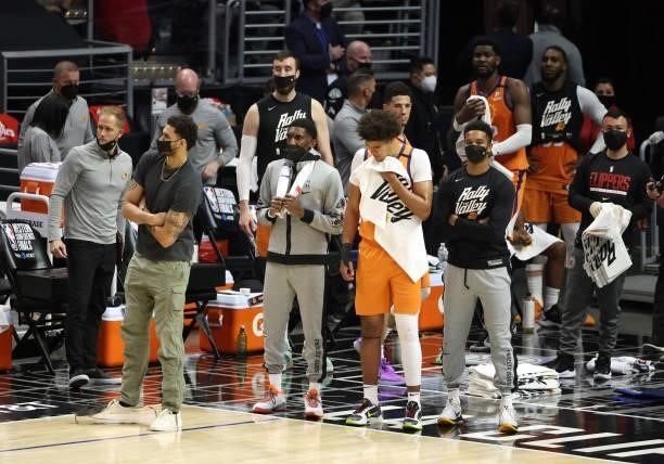 Members of the Phoenix Suns react to the team's loss against the LA Clippers during the second half of game three of the Western Conference Finals at...