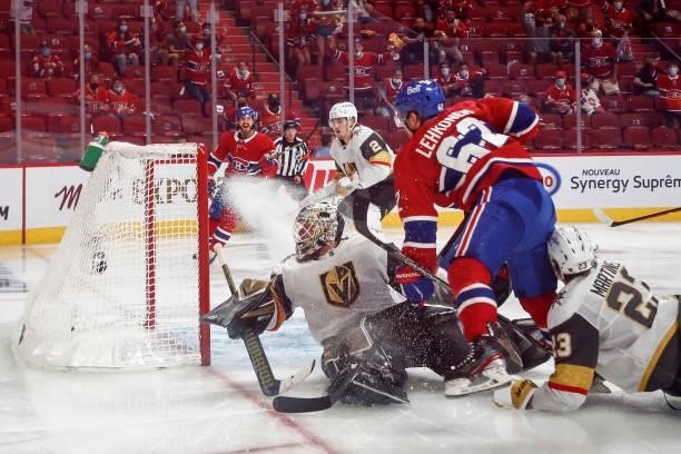 Artturi Lehkonen of the Montreal Canadiens scores the game-winning goal past Robin Lehner of the Vegas Golden Knights during the first overtime...
