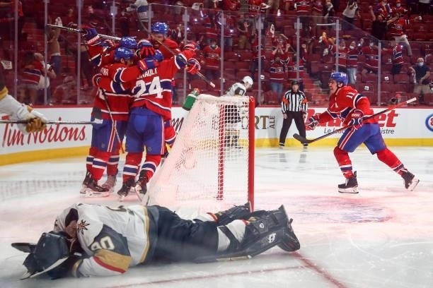 Robin Lehner of the Vegas Golden Knights reacts after allowing the game-winning overtime goal to Artturi Lehkonen of the Montreal Canadiens who is...