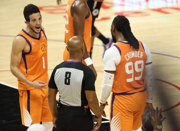 Devin Booker of the Phoenix Suns argues a fifth foul call on teammate Jae Crowder with referee Marc Davis during the second half of game three of the...