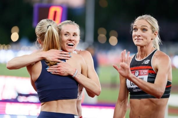 Courtney Frerichs hugs Val Constien as Emma Coburn waves after competing in the Women's 3,000 Meter Steeplechase Final on day seven of the 2020 U.S....