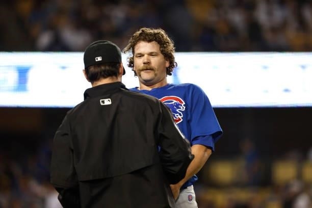 Andrew Chafin of the Chicago Cubs is searched for substances following the eighth inning during a game against the Los Angeles Dodgers at Dodger...