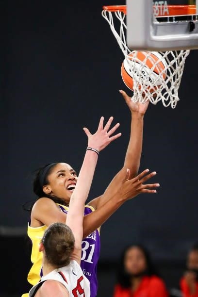 Forward/center Kristine Anigwe of the Los Angeles Sparks shoots defended by forward Theresa Plaisance of the Washington Mystics in the second half at...