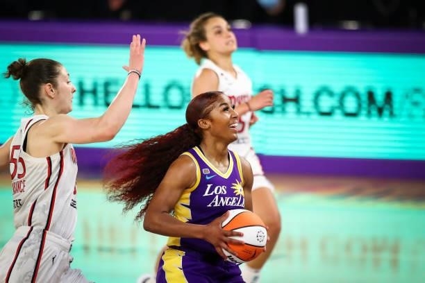 Guard Te'a Cooper of the Los Angeles Sparks reacts to being fouled in the second half against the Washington Mystics at Los Angeles Convention Center...