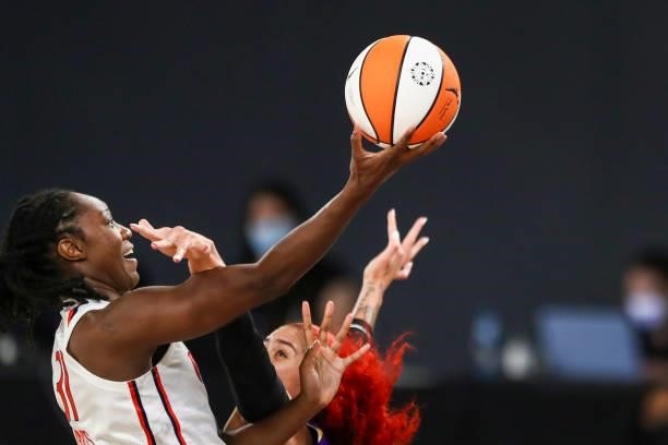 Center Tina Charles of the Washington Mystics drives to the basket defended by center Amanda Zahui B of the Los Angeles Sparks at Los Angeles...