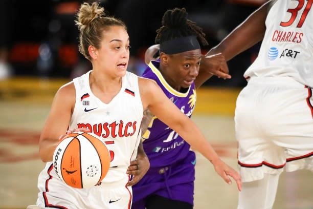 Guard Leilani Mitchell of the Washington Mystics handles the ball defended by guard Erica Wheeler of the Los Angeles Sparks at Los Angeles Convention...