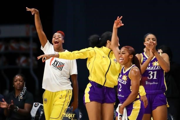 Guards Bria Holmes, Arella Guirantes, Te'a Cooper, and forward/center Kristine Anigwe of the Los Angeles Sparks celebrate a three point basket by...