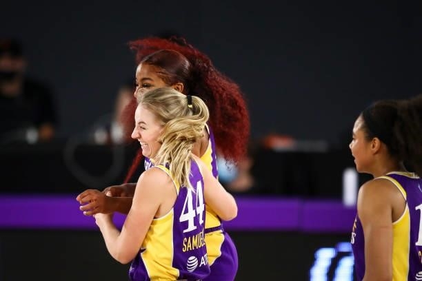 Forward Karlie Samuelson of the Los Angeles Sparks celebrates her basket with guard Te'a Cooper at the end of the first half against the Washington...