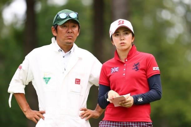 Kotone Hori of Japan talks with her coach and caddie Morihiro Mori during the second round of the Earth Mondamin Cup at Camellia Hills Country Club...