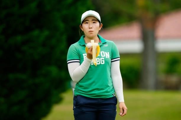 Yumi Kudo of Japan has a bite on her way to the 10th tee during the final round of the JLPGA Pro Test at Shizu Hills Country Club on June 25, 2021 in...