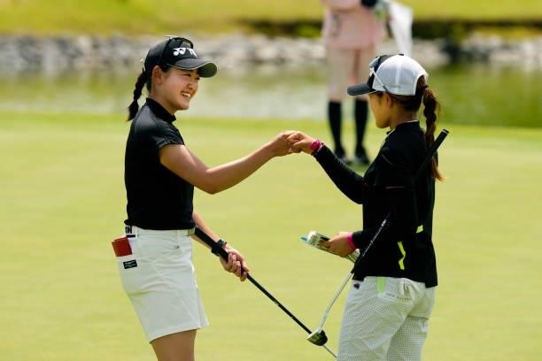 Chisato Iwai and Sae Ogura of Japan fist bump after holing out on the 18th green during the final round of the JLPGA Pro Test at Shizu Hills Country...