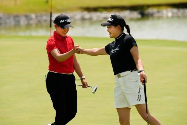 Akie Iwai and Chisato Iwai of Japan fist bump after holing out on the 18th green during the final round of the JLPGA Pro Test at Shizu Hills Country...