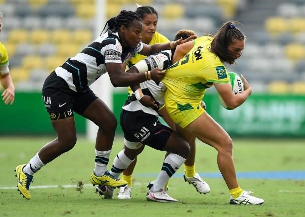 Evania Pelite of Australia is tackled during the Oceania Sevens Challenge match between Fiji and Australia at Queensland Country Bank Stadium on June...