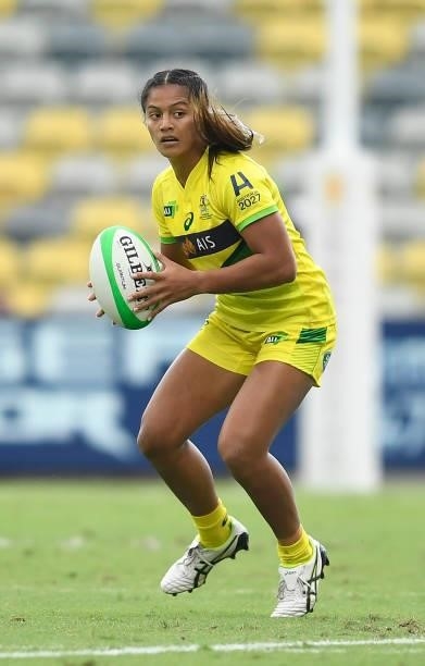 Sariah Paki of Australia runs the ball during the Oceania Sevens Challenge match between Fiji and Australia at Queensland Country Bank Stadium on...