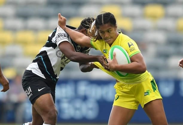 Sariah Paki of Australia is tackled during the Oceania Sevens Challenge match between Fiji and Australia at Queensland Country Bank Stadium on June...