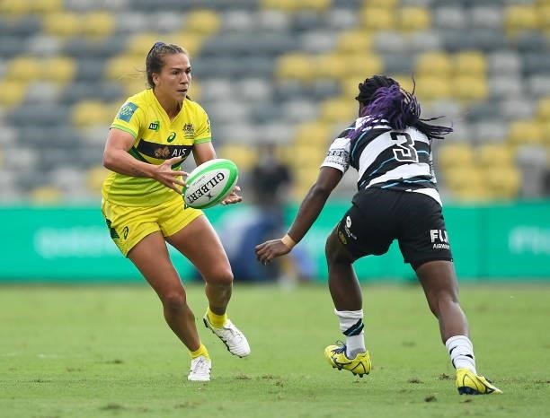 Evania Pelite of Australia runs the ball runs the ball during the Oceania Sevens Challenge match between Fiji and Australia at Queensland Country...