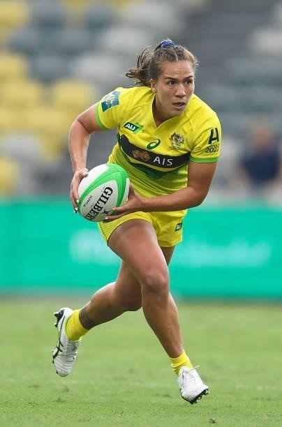 Evania Pelite of Australia runs the ball runs the ball during the Oceania Sevens Challenge match between Fiji and Australia at Queensland Country...