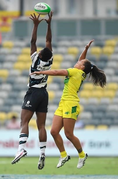 Evania Pelite of Australia contests a high ball with Vani Buleki of Fiji during the Oceania Sevens Challenge match between Fiji and Australia at...
