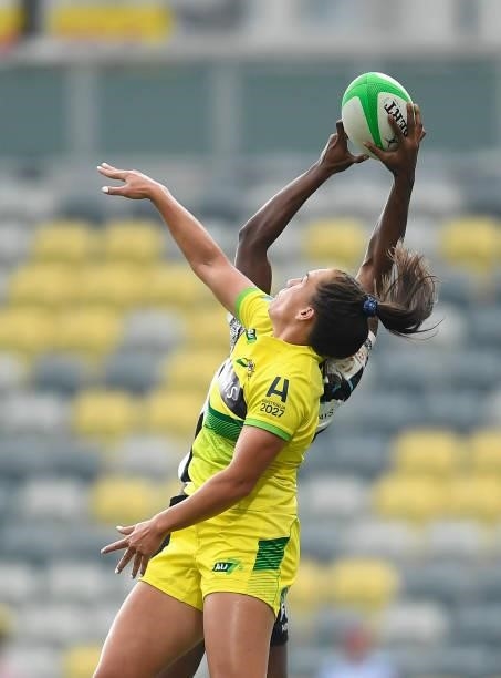 Evania Pelite of Australia contests a high ball with Vani Buleki of Fiji during the Oceania Sevens Challenge match between Fiji and Australia at...