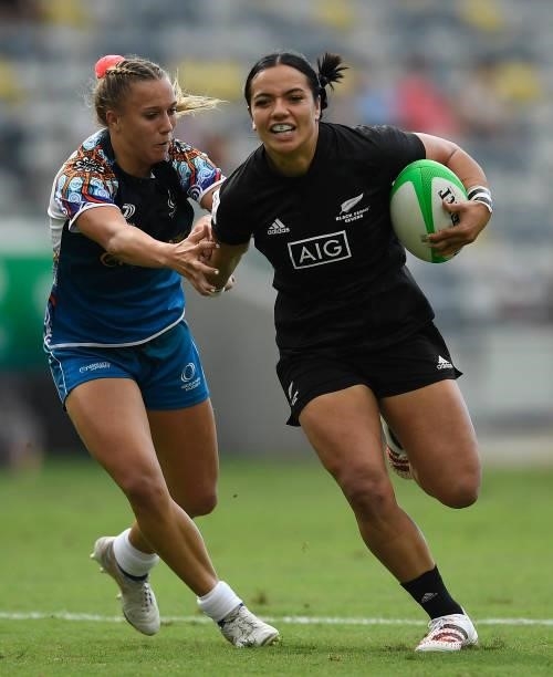 Stacey Waaka of New Zealand fends off a defender during the Oceania Sevens Challenge match between New Zealand and Oceania at Queensland Country Bank...