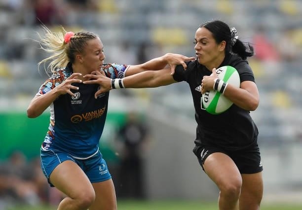 Stacey Waaka of New Zealand fends off a defender during the Oceania Sevens Challenge match between New Zealand and Oceania at Queensland Country Bank...