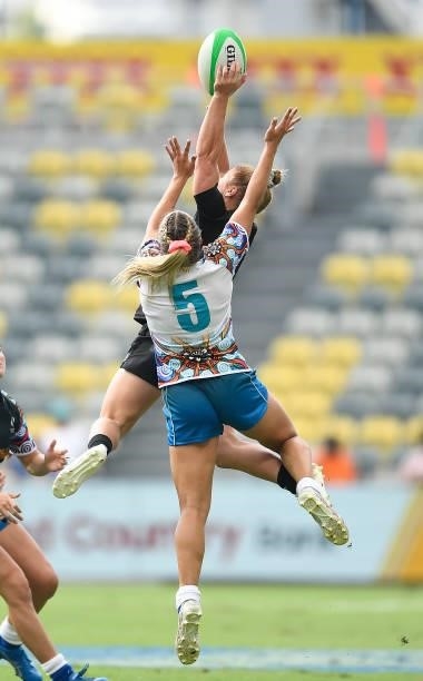 Michaela Blyde of New Zealand contest a high ball with Teahan Levi of Oceania during the Oceania Sevens Challenge match between New Zealand and...