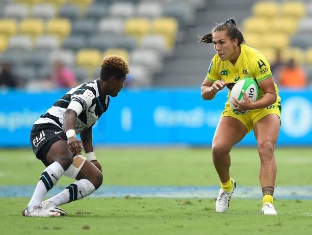Evania Pelite of Australia is tackled by Lavena Cavuru of Fiji during the Oceania Sevens Challenge match between Fiji and Australia at Queensland...