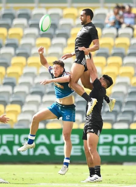 Sione Molia of New Zealand contests a high ball during the Oceania Sevens Challenge match between New Zealand and Oceania at Queensland Country Bank...