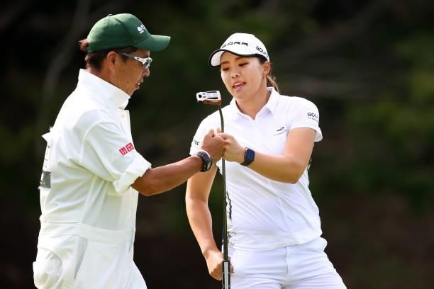 Keiko Yamamoto of Japan fist bumps with her caddie after the birdie on the 16th green during the second round of the Earth Mondamin Cup at Camellia...