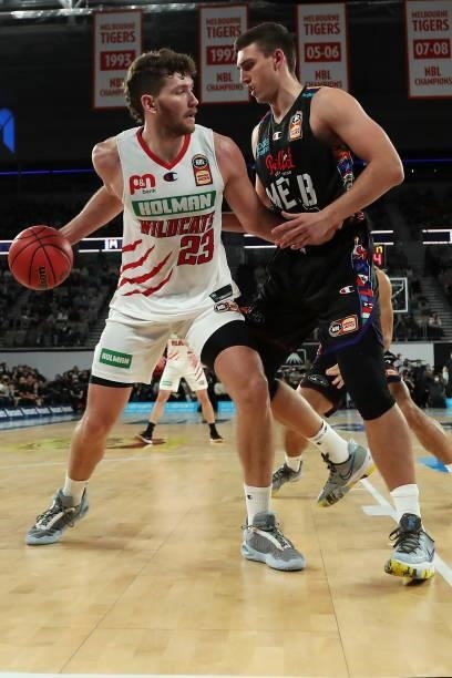 Will Magnay of the Wildcats looks to drive past Mason Peatling of Melbourne United during game three of the NBL Grand Final Series between Melbourne...