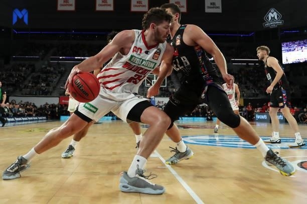 Will Magnay of the Wildcats looks drives past Mason Peatling of Melbourne United during game three of the NBL Grand Final Series between Melbourne...