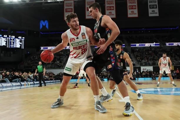 Will Magnay of the Wildcats looks to drive past Mason Peatling of Melbourne United during game three of the NBL Grand Final Series between Melbourne...