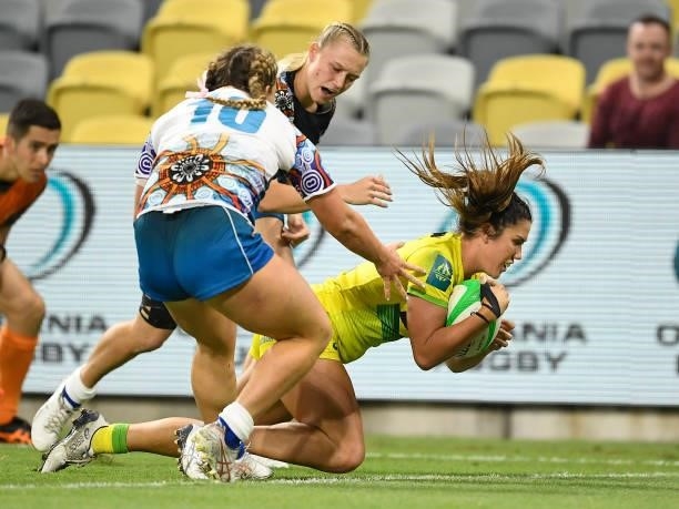 Charlotte Caslick of Australia scores a try during the Oceania Sevens Challenge match between Australia and Oceania at Queensland Country Bank...