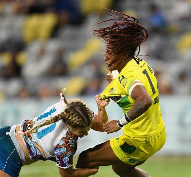 Ellia Green of Australia is tackled by Isabella Nasser of Oceania during the Oceania Sevens Challenge match between Australia and Oceania at...