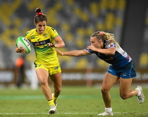 Madison Higgins-Ashby of Australia gets away from the Oceania defence during the Oceania Sevens Challenge match between Australia and Oceania at...