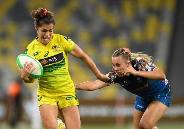 Madison Higgins-Ashby of Australia gets away from the Oceania defence during the Oceania Sevens Challenge match between Australia and Oceania at...