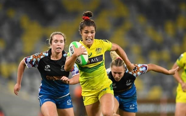 Madison Higgins-Ashby of Australia runs to score a try during the Oceania Sevens Challenge match between Australia and Oceania at Queensland Country...