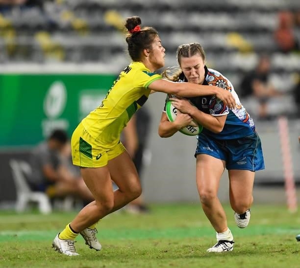 Georgia Hannaway of Oceania is tackled by Madison Higgins-Ashby of Australia during the Oceania Sevens Challenge match between Australia and Oceania...