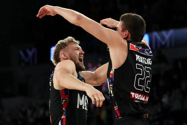 Jock Landale and Mason Peatling of Melbourne United celebrate victory during game three of the NBL Grand Final Series between Melbourne United and...