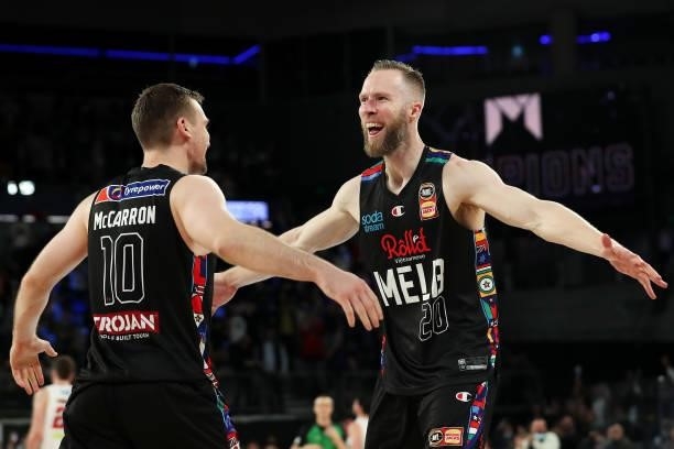 Mitch McCarron and David Barlow of Melbourne United celebrate victory during game three of the NBL Grand Final Series between Melbourne United and...