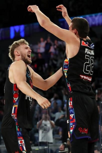 Jock Landale and Mason Peatling of Melbourne United celebrate victory during game three of the NBL Grand Final Series between Melbourne United and...