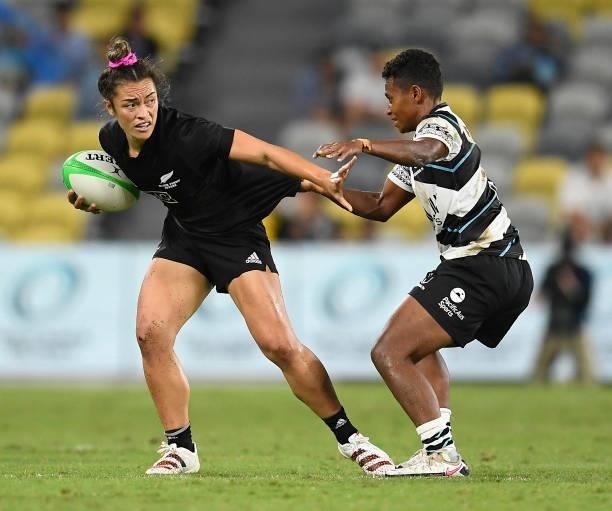 Theresa Fitzpatrick of New Zealand is tackled during the Oceania Sevens Challenge match between New Zealand and Fiji at Queensland Country Bank...