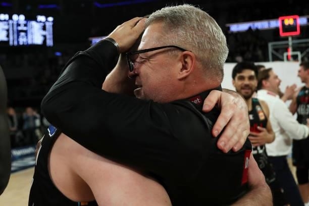 United coach Dean Vickerman and Mitch McCarron of Melbourne United celebrate victory after game three of the NBL Grand Final Series between Melbourne...