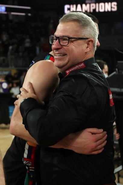 United coach Dean Vickerman and Mitch McCarron of Melbourne United celebrate victory after game three of the NBL Grand Final Series between Melbourne...
