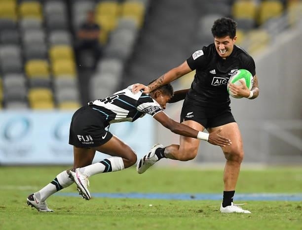 Gayle Broughton of New Zealand is tackled by Reapi Ulunasau of Fiji during the Oceania Sevens Challenge match between New Zealand and Fiji at...