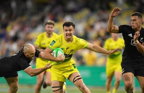 Dylan Pietsch of Australia is tackled during the Oceania Sevens Challenge match between New Zealand and Australia at Queensland Country Bank Stadium...