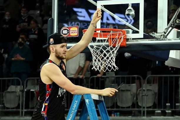 Jock Landale of Melbourne United cuts off the net as he celebrates victory after game three of the NBL Grand Final Series between Melbourne United...