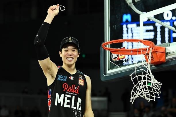 Yudai Baba of Melbourne United cuts off the net as he celebrates victory after game three of the NBL Grand Final Series between Melbourne United and...