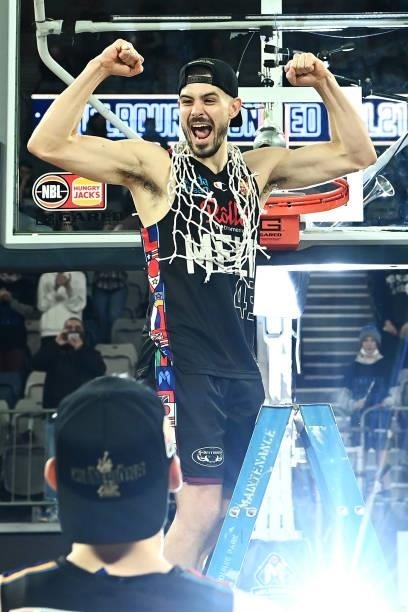 Chris Goulding of Melbourne United celebrates victory after cutting off the net after game three of the NBL Grand Final Series between Melbourne...