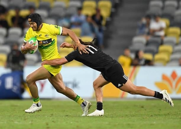Pama Fou of Australia is tackled by Joe Webber of New Zealand during the Oceania Sevens Challenge match between New Zealand and Australia at...